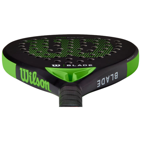 A paddle with a rounded head features a black surface with green accents and perforations for grip in the design. The paddle is labeled with the brand Wilson and the model Blade Elite.