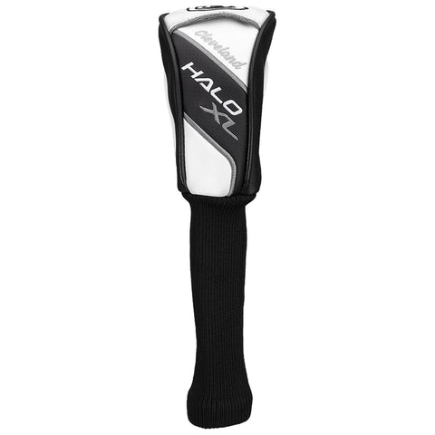 A golf club headcover is standing upright with a sleek design. It protects the club while showcasing a combination of black and white colors with a textured surface.