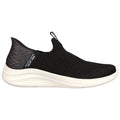 A black slip-on sneaker features a textured upper with elasticated sides for ease of wear and a white sole that provides cushioning designed for comfort and casual use.