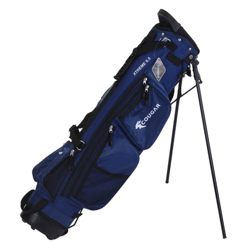 A blue golf bag is positioned upright on a tripod stand featuring multiple zippered pockets for storage highlighting its brand name Cougar and model Xtreme 5 5 in white lettering.