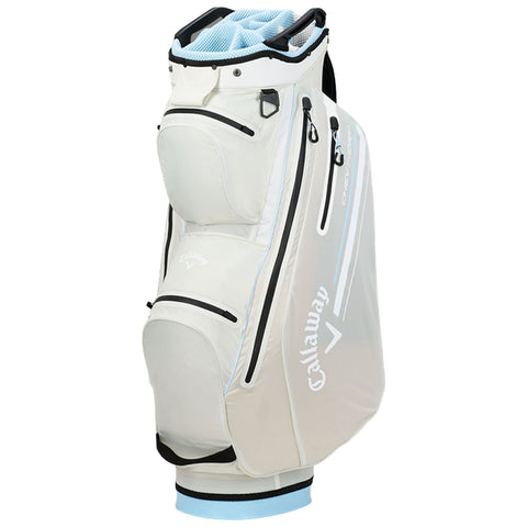 A golf bag stands upright showcasing multiple compartments and a light-colored exterior. It features zippers and a structured top for easy club access, suitable for outdoor golf activities.