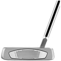 A silver golf putter is positioned upright showcasing its flat striking surface with grooves The context suggests it is prepared for use on a green or putting surface