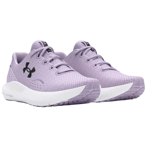 Purple athletic shoes with a textured upper and white sole are displayed side by side showcasing the lace-up design and prominent black logo on the side in a neutral background setting.