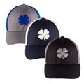 Three caps are displayed in a row featuring a four-leaf clover design. The colors include gray with blue, navy with white, and black with gray and they are set against a plain background.