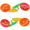 Colorful golf markers are arranged in pairs with visible branding. They are placed upright on a flat surface, suggesting use during a game or practice session.