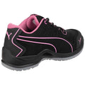 A black athletic shoe with pink accents is positioned at an angle showcasing its design and texture featuring laces and a padded collar in a neutral background.