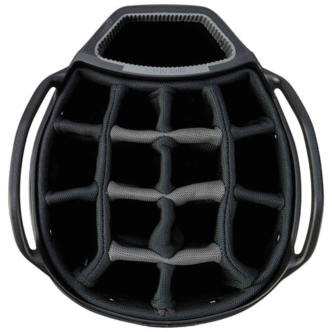 A black helmet interior features a grid of padded sections designed for impact absorption with a textured opening at the top and two handles attached on the sides.