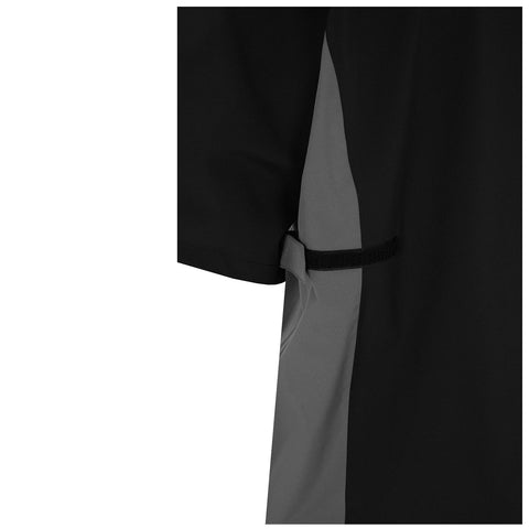 A black and gray shirt hangs with a side detail featuring a tied strap indicating a design for adjustable fitting or securing items with a simple yet functional aesthetic.