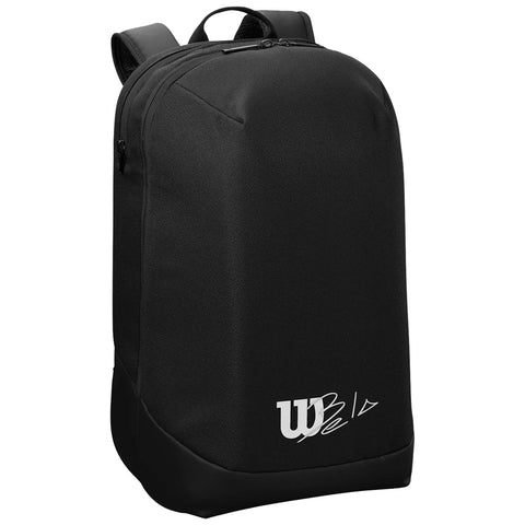 A black backpack with a sleek design sits upright showcasing a smooth surface and minimalistic appearance featuring a logo in white at the bottom corner.