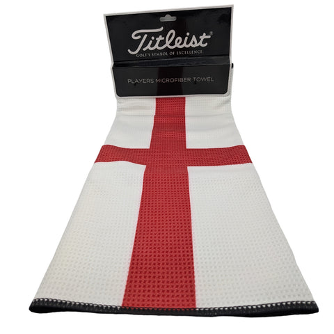 A microfiber towel is displayed prominently featuring a white background with a large red cross design it is branded with Titleist and labeled as Players Microfiber Towel