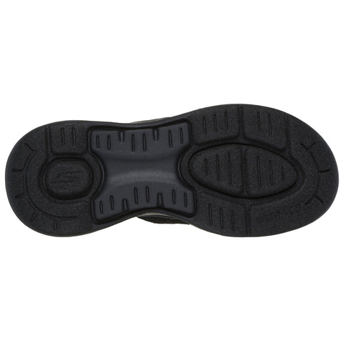 A shoe sole rests flat showing grooves and patterns designed for traction with a smooth central area suitable for comfort and grip on various surfaces.