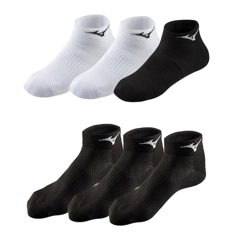 Four pairs of short athletic socks are displayed two white pairs on top and two black pairs below each featuring a logo and a textured design suitable for sports and casual wear.