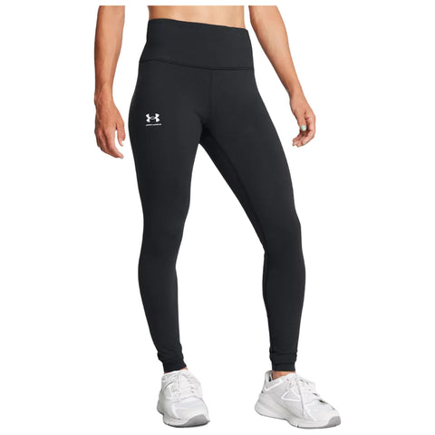 Black athletic leggings are worn by a person standing in a relaxed pose with a slight tilt. The background is plain emphasizing the outfit designed for active wear.