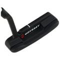 A black golf putter rests on a flat surface with the brand name Odyssey displayed prominently the putter's head features a smooth underside and a single alignment line for precision.