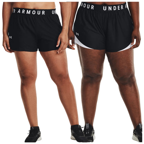 Two pairs of athletic shorts in black with white accents are displayed side by side showcasing different styles and fits designed for comfortable wear during physical activities.