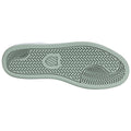 A shoe sole is depicted with a textured tread pattern designed for grip and traction showcasing a mint green hue in a clean and isolated setting