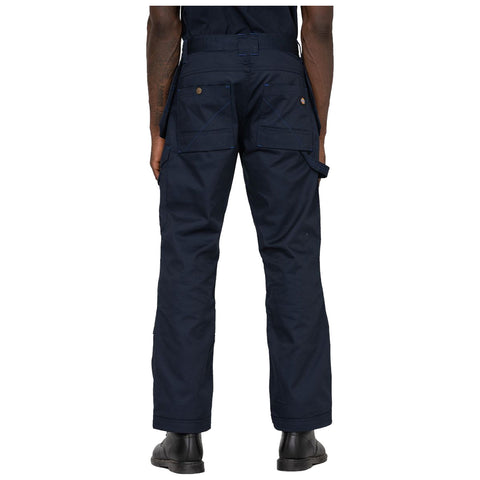 Dark blue work pants are worn by a person facing away showing multiple pockets and loops in an indoor setting with a plain white background. The person is standing still.