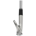 A golf club with a sleek silver head and a black grip is positioned vertically its angled face implies readiness for a swing on a golf course.