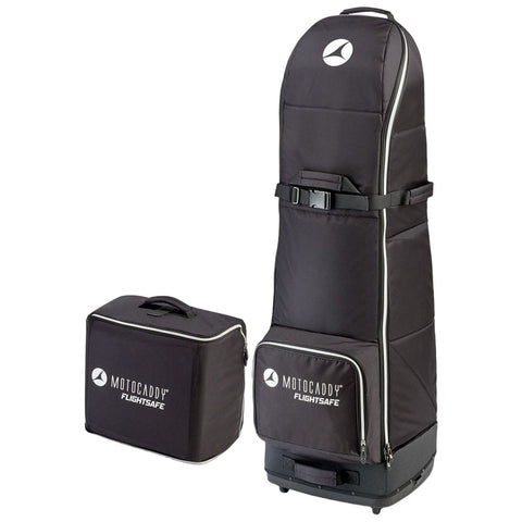 A tall black golf travel bag with a smooth exterior stands upright next to a smaller rectangular bag both featuring the Motocaddy Flightsafe logo designed for protecting golf equipment during travel.