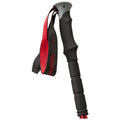 A black and red trekking pole stands upright featuring a rubber grip and a adjustable strap attached to the handle designed for hiking and outdoor activities.