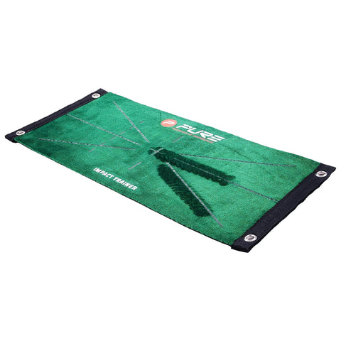 A green golf impact trainer mat features a logo and markings for swing practice. It lies flat on a surface, designed to improve a golfer's impact point and technique.