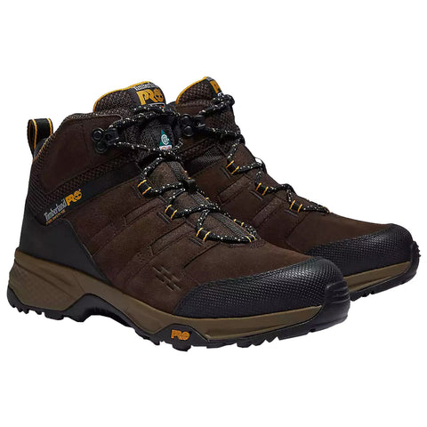 Brown hiking boots are positioned side by side with laces threaded through metal eyelets the boots feature reinforced toes and a rugged sole designed for outdoor activities