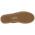 A brown shoe sole is shown with a textured surface featuring a diamond pattern and the brand name Skechers embossed in the center highlighting its design for grip and comfort.