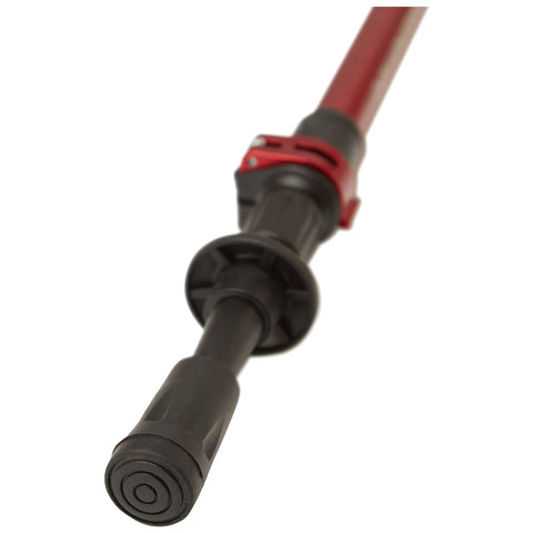 A red and black adjustable pole features a smooth grip handle and a locking mechanism at the top designed for stability and support during various activities outdoors.