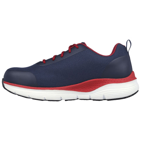 A navy blue athletic shoe features a textured surface with red accents and white rubber soles while positioned against a plain background conveying a sporty and casual design.