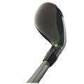 A golf club head is angled upwards showing a shiny black surface and a marking for adjustment settings near its neck while the shaft tapers downwards, held in a neutral position.