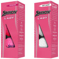 Two golf ball packages display pink and white balls labeled Srixon Soft Feel Lady featuring performance descriptors like feel distance and flight surrounded by a colorful design in a retail setting.