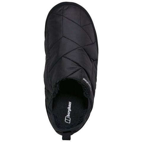 A black quilted slipper features a cozy interior and an open back design suitable for indoor wear placed on a flat surface indicating comfort and warmth for the feet.