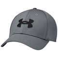 A gray baseball cap with a black Under Armour logo sits tilted slightly to one side showcasing its structured brim and fabric texture against a neutral background.