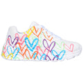 A white athletic shoe displays a vibrant pattern of colorful hearts in various hues. The shoe rests on a plain background, showcasing its playful design.