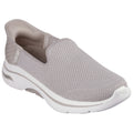 A gray slip-on sneaker with a mesh upper is positioned prominently. It is designed for comfort and ease of wear in casual settings. The sole has a slight curve for support.