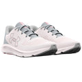 A pair of athletic shoes is positioned side by side showcasing a light gray and white mesh upper with subtle pink accents and a textured sole designed for running or training.