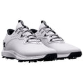 White golf shoes are positioned side by side displaying a sleek design including a textured upper and spiked outsole suitable for traction on grass surfaces.