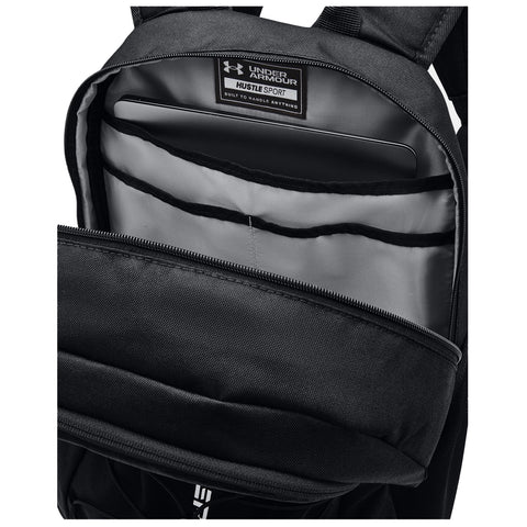 A black backpack with a gray interior features compartments for organizing items including a laptop pocket at the back and a main zippered section for storage.