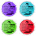 Four circular hand warmers are displayed in different colors: purple, blue, green, and red. Each has operating instructions, safety warnings, and content details printed on it, located in a flat arrangement.