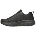 A black athletic shoe with textured mesh panels features laces and a thick rubber sole designed for comfort and support placed against a neutral background