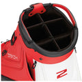 A golf bag with a red and white design features a spacious opening lined with black fabric and dividers for organizing clubs set against a neutral background.