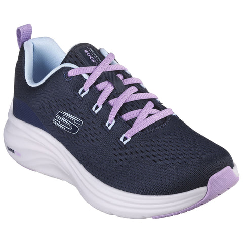 A dark blue athletic shoe with a light blue interior and purple laces is positioned prominently. It features a textured fabric top and a cushioned white sole, suitable for active wear.