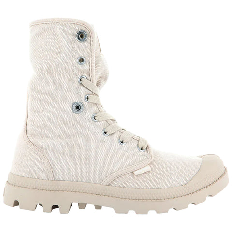 A light-colored canvas boot stands upright showcasing a high top with eyelets and laces while featuring a rugged sole designed for traction in varied terrains.