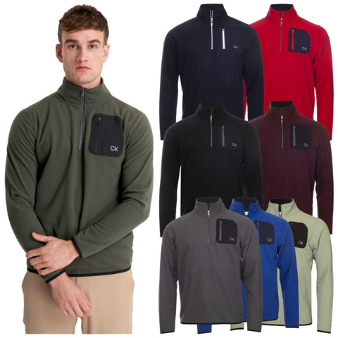 A young man in a green fleece pullover stands with arms crossed showcasing various colored fleece pullovers displayed behind him in a retail setting or catalog.