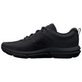 A black athletic shoe sits on a plain background showcasing a sleek design with a textured upper and prominent brand logo highlighting its purpose for sports and exercise.