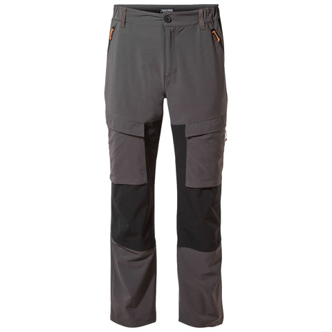 Gray hiking pants display pockets and contrasting black detailing at the bottom. They are designed for outdoor activities, emphasizing durability and utility in rugged environments.