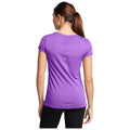 A purple short-sleeved athletic shirt is worn by a person seen from the back with long hair. The setting appears neutral and focuses solely on the shirt's color and fit.