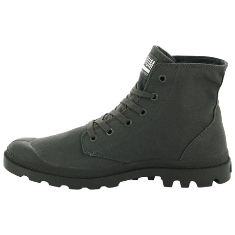 A green canvas ankle boot features a rubber toe cap and a textured sole with deep grooves providing traction laced up the front showcasing a casual and sturdy design.