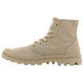 A light tan ankle boot with laces and a rubber sole stands upright against a plain background showcasing its canvas texture and rugged design ideal for casual wear or outdoor activities