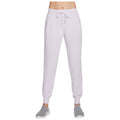 Light purple sweatpants are worn with a drawstring waist and gathered ankles while paired with gray athletic shoes in a neutral background setting.